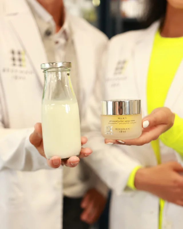Beekman 1802 goat milk skincare showcased beside a bottle of milk